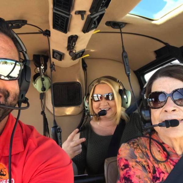 a man wearing sunglasses taking a selfie