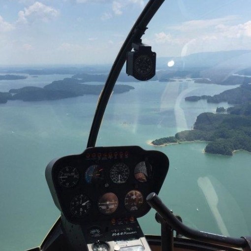 a man driving a boat in the water