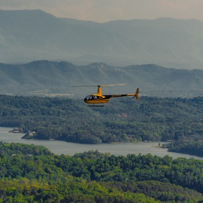 a large body of water with a mountain in the background