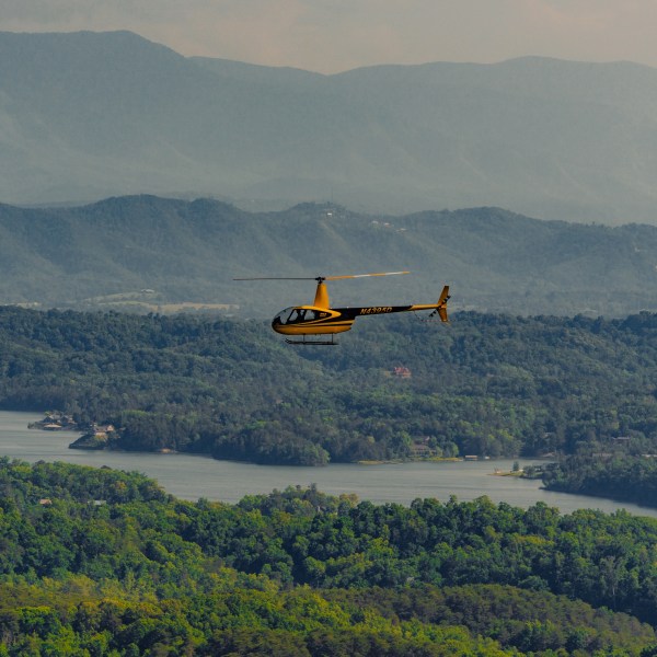 a large body of water with a mountain in the background