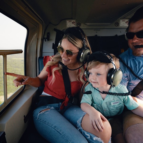 a woman in sunglasses sitting in a car